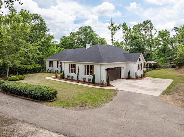 473 Sugarcreek Dr, Grovetown, GA 30813 - view of front of property featuring an attached garage, a front lawn, driveway, and a chimney