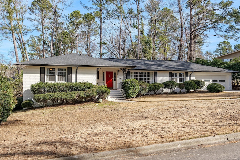 ranch-style home featuring a garage