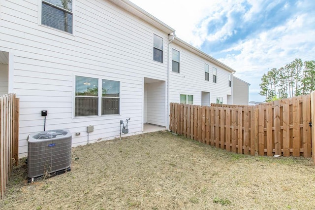 950 Quaint Parish Cir, Graniteville, SC 29829 - back of property featuring a yard, central AC unit, and fence