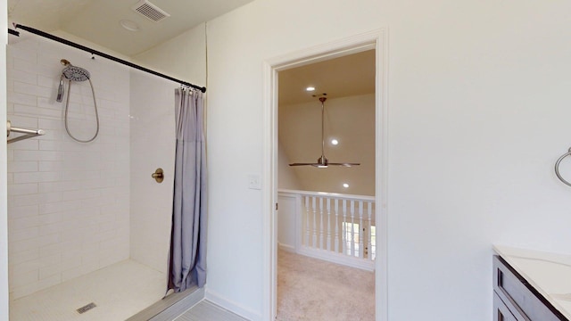 122 Ehrlich Farm Rd, Swainsboro, GA 30401 - full bathroom with a tile shower, vanity, ceiling fan, and recessed lighting