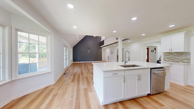 122 Ehrlich Farm Rd, Swainsboro, GA 30401 - kitchen featuring stainless steel dishwasher, light wood-style floors, a center island with sink, light countertops, and recessed lighting