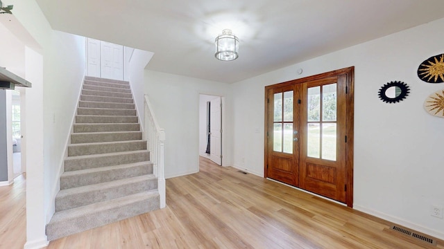 122 Ehrlich Farm Rd, Swainsboro, GA 30401 - entryway featuring stairs, healthy amount of natural light, light wood-style floors, and french doors