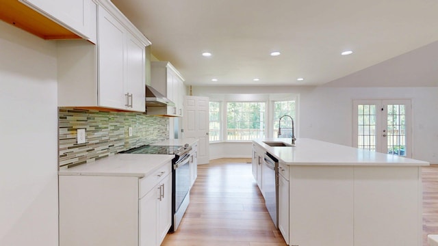 122 Ehrlich Farm Rd, Swainsboro, GA 30401 - kitchen with stainless steel appliances, light wood finished floors, decorative backsplash, recessed lighting, and white cabinetry