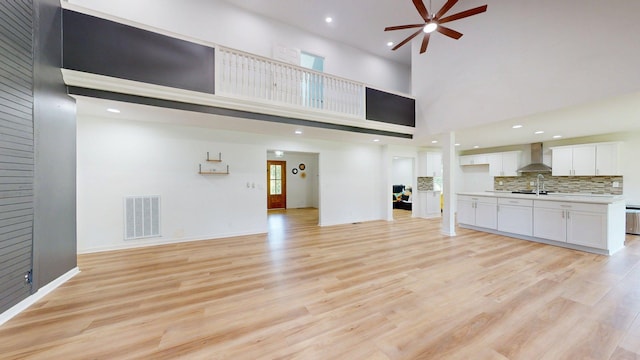 122 Ehrlich Farm Rd, Swainsboro, GA 30401 - unfurnished living room featuring ceiling fan, light wood finished floors, a high ceiling, and recessed lighting