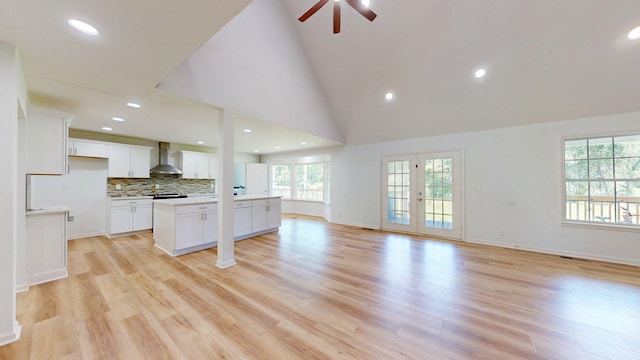 122 Ehrlich Farm Rd, Swainsboro, GA 30401 - unfurnished living room featuring a ceiling fan, light wood-style floors, recessed lighting, and a high ceiling
