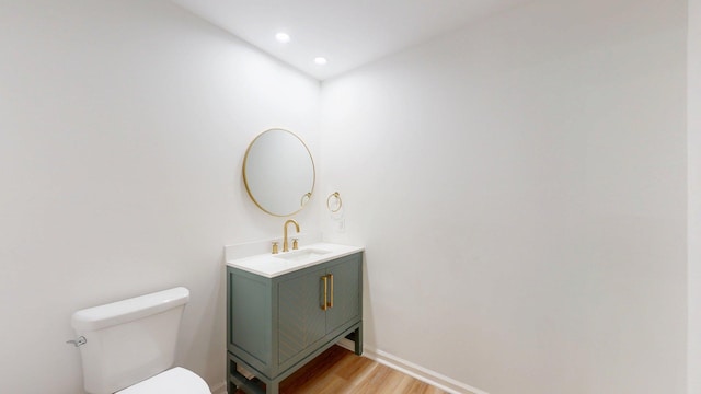 122 Ehrlich Farm Rd, Swainsboro, GA 30401 - half bath featuring wood finished floors, vanity, and recessed lighting