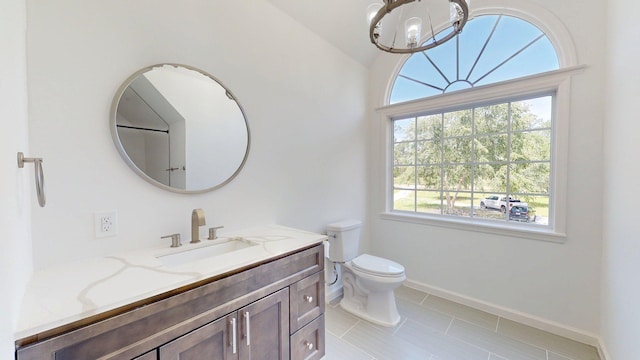 122 Ehrlich Farm Rd, Swainsboro, GA 30401 - bathroom featuring vanity, healthy amount of natural light, a chandelier, and tile patterned flooring