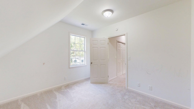 122 Ehrlich Farm Rd, Swainsboro, GA 30401 - unfurnished bedroom with light colored carpet and lofted ceiling
