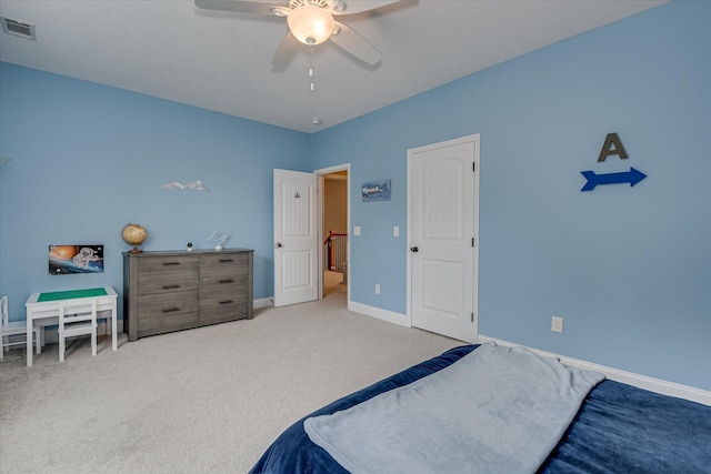 carpeted bedroom with baseboards and ceiling fan