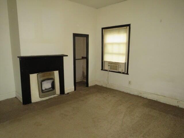 1916 Walker St, Augusta, GA 30904 - unfurnished living room with carpet flooring and cooling unit