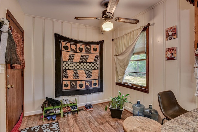 413 Dixie Dr, Thomson, GA 30824 - living area with wood finished floors, a decorative wall, and ceiling fan