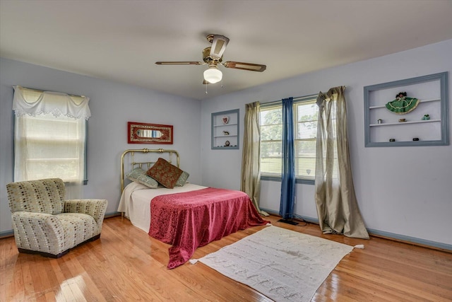 bedroom featuring light hardwood / wood-style flooring and ceiling fan