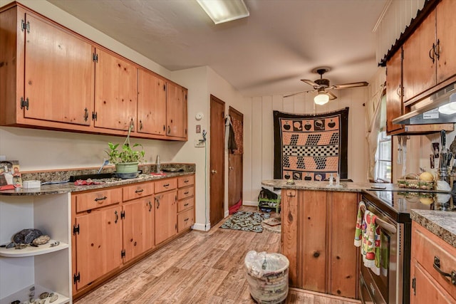 kitchen with electric range, stone counters, ceiling fan, kitchen peninsula, and light wood-type flooring