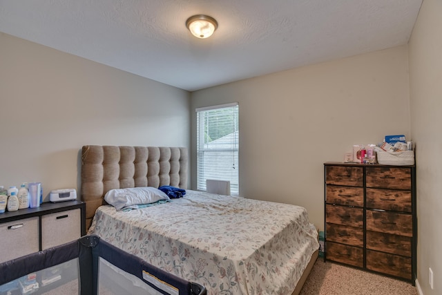 carpeted bedroom with a textured ceiling