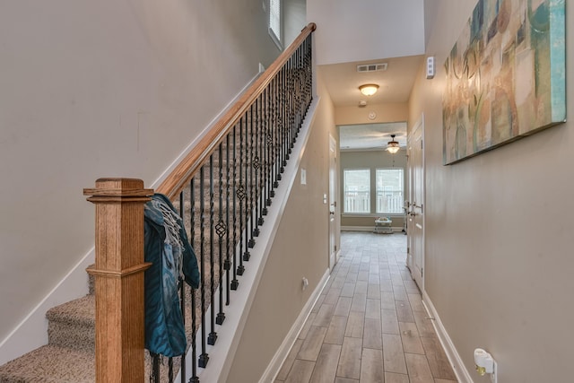 stairs with ceiling fan