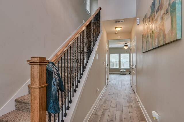 stairs with ceiling fan