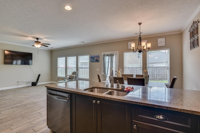 kitchen with stone counters, pendant lighting, light hardwood / wood-style floors, and stainless steel dishwasher