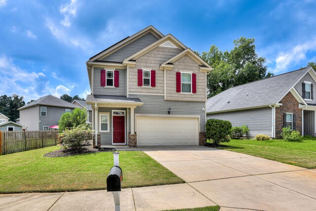 craftsman-style home featuring a garage and a front yard