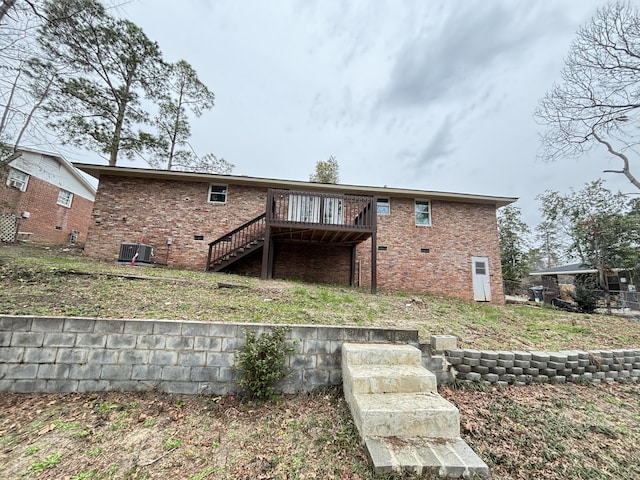 back of house with a wooden deck