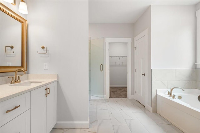 bathroom with vanity and independent shower and bath