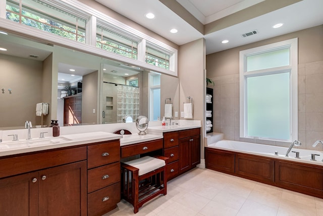 bathroom featuring shower with separate bathtub, vanity, ornamental molding, and a healthy amount of sunlight