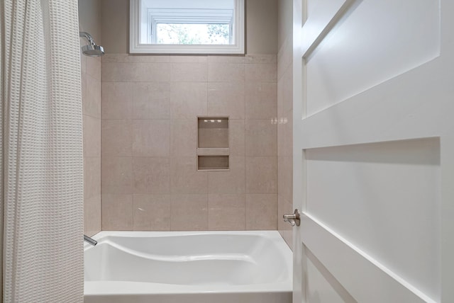 bathroom featuring shower / bathtub combination with curtain