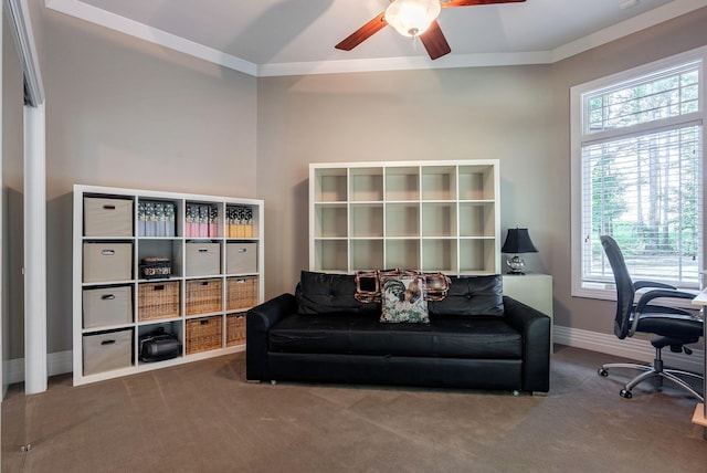 living area with carpet flooring, ceiling fan, and vaulted ceiling