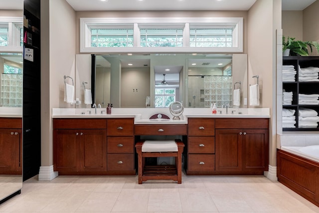 bathroom with shower with separate bathtub and vanity