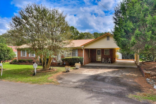 ranch-style home featuring a front yard and a carport