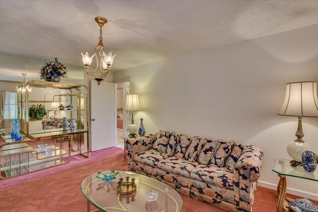 carpeted living room featuring a textured ceiling and an inviting chandelier