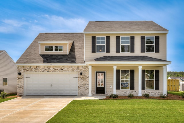 1663 Pine Ridge Dr N, Hephzibah, GA 30815 - view of front facade featuring brick siding, a front lawn, concrete driveway, and a garage