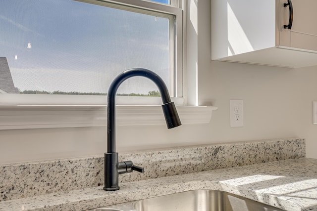 1663 Pine Ridge Dr N, Hephzibah, GA 30815 - kitchen view of a sink and light stone countertops
