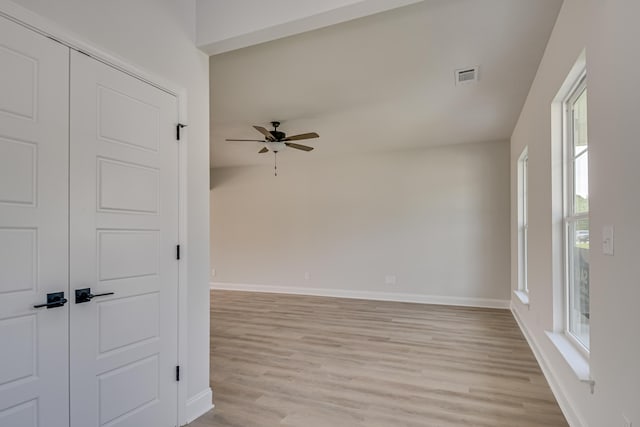 1663 Pine Ridge Dr N, Hephzibah, GA 30815 - empty room featuring a ceiling fan, light wood-style floors, baseboards, and healthy amount of natural light