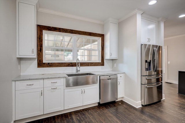 2911 Lombardy Ct, Augusta, GA 30909 - kitchen featuring stainless steel appliances, ornamental molding, dark wood finished floors, light stone countertops, and white cabinetry