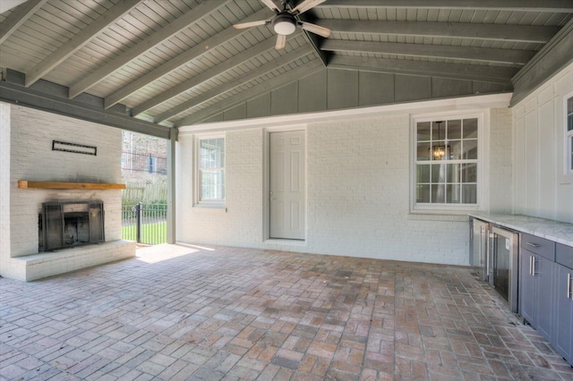 2911 Lombardy Ct, Augusta, GA 30909 - view of patio featuring an outdoor brick fireplace, ceiling fan, beverage cooler, and exterior kitchen