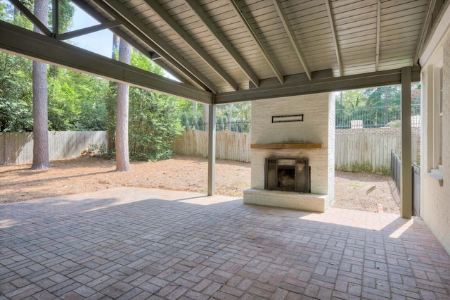 2911 Lombardy Ct, Augusta, GA 30909 - fenced backyard with an outdoor brick fireplace and a patio