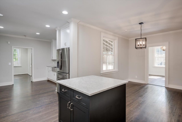 2911 Lombardy Ct, Augusta, GA 30909 - kitchen featuring white cabinets, dark wood finished floors, a chandelier, dark cabinetry, and ornamental molding