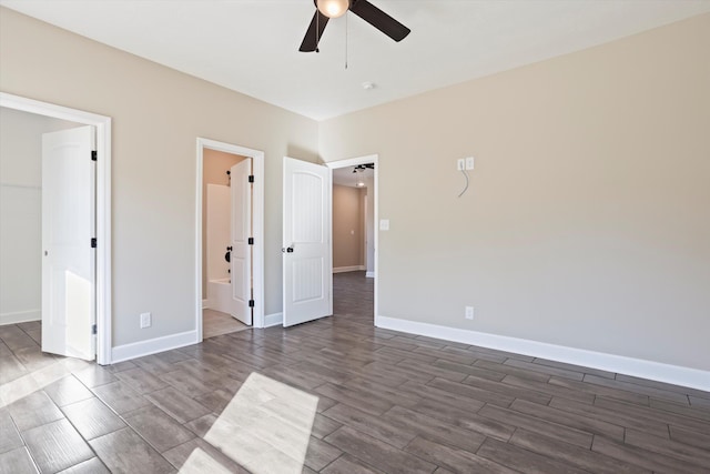 unfurnished bedroom featuring ceiling fan and ensuite bathroom