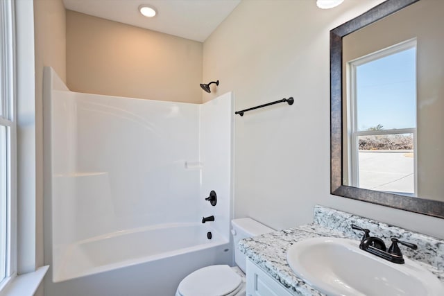 full bathroom with shower / bath combination, vanity, and toilet