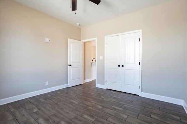 unfurnished bedroom featuring a closet and ceiling fan