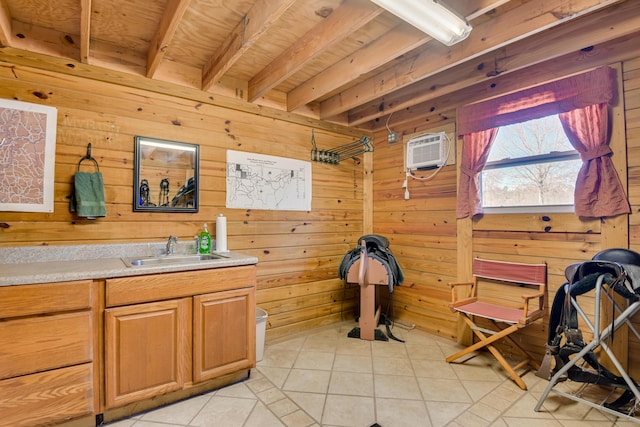 bathroom featuring tile patterned floors, wood walls, a wall unit AC, and beam ceiling