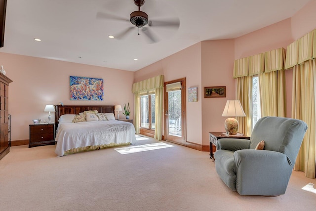 carpeted bedroom with multiple windows, access to outside, and ceiling fan