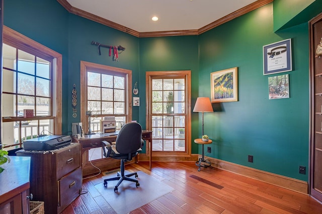 office with crown molding and light hardwood / wood-style flooring