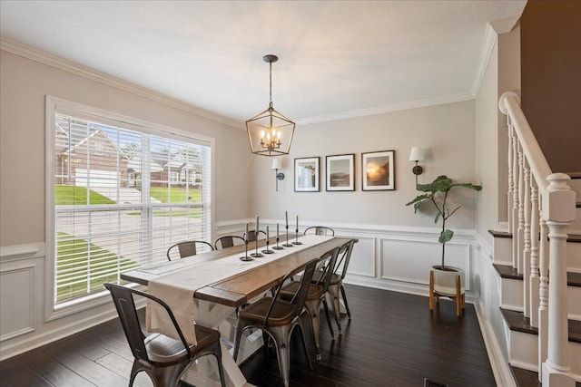 3933 High Chaparral Dr, Martinez, GA 30907 - dining area with a chandelier, dark wood-style flooring, crown molding, a wainscoted wall, and stairway
