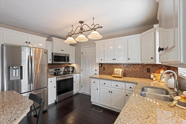 3933 High Chaparral Dr, Martinez, GA 30907 - kitchen featuring stainless steel appliances, a sink, and white cabinetry