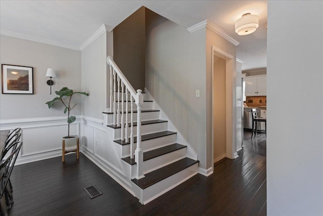 3933 High Chaparral Dr, Martinez, GA 30907 - staircase with ornamental molding, wood finished floors, and a wainscoted wall