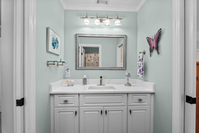 bathroom with visible vents, ornamental molding, and vanity