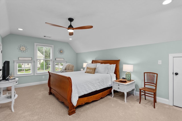 bedroom with visible vents, baseboards, and lofted ceiling