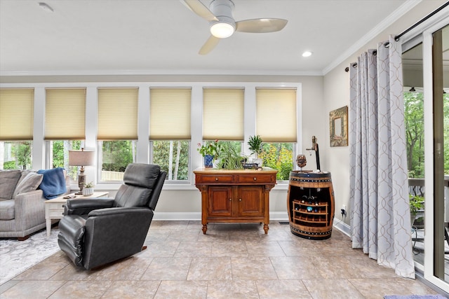 sitting room with crown molding, a ceiling fan, baseboards, and recessed lighting