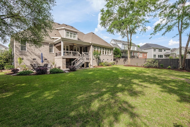 view of yard with fence, a residential view, stairs, ceiling fan, and a patio